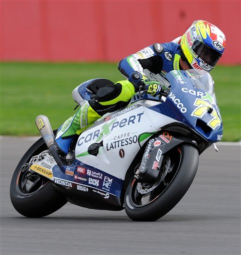 Switzerland's Dominique Aegerter of Technomag Suter in action during Moto 2 qualifying session for the British Grand Prix at Silverstone, England, Saturday, Aug. 30, 2014. (AP Photo)