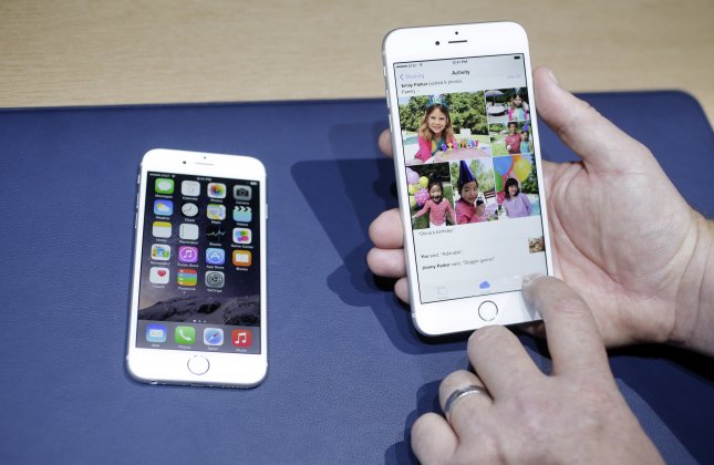 The iPhone 6, at left, and iPhone 6 plus are shown next to each other during a new product release