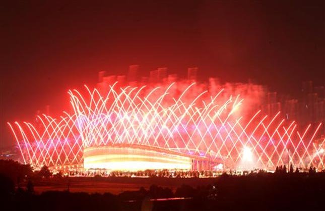 Fireworks explode over Incheon Asiad Main Stadium during the opening ceremony for the 17th Asian Games in Incheon, South Korea,Friday, Sept. 19, 2014.