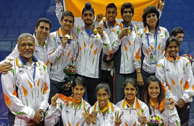 Group picture of Indian squash teams that won the gold (men) and silver (women) in the Asian Games team championship in Incheon on Saturday.