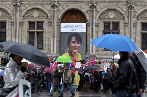 A portrait of leader Aung San Suu Kyi is seen in front of City Hall, in Paris, France. Saturday, Nov. 13, 2010. Myanmar's military government freed Suu Kyi on Saturday after her latest term of detention spanning 7 1/2 years expired. The 65 year old Nobel Peace Prize laureate has been jailed or under house arrest for more than 15 of the last 21 years. Above the portrait is writing Aung San Suu Kyi Citizen of honor of the city of Paris, free (AP Photo/Jacques Brinon)