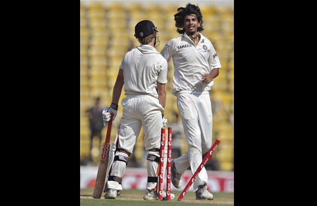 India's Ishant Sharma, right, celebrates the dismissal of New Zealand's Kane Williamson, left, during the fourth day of their last cricket test match, in Nagpur, India, Tuesday, Nov. 23, 2010. (AP Photo/Aijaz Rahi)