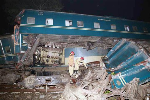 Rescuers work at the site of a train accident in Narsingdi district, about 25 miles (40 kilometers) east of Dhaka, Bangladesh, Wednesday, Dec. 8, 2010. A speeding train slammed into another moving slowly through a station in eastern Bangladesh on Wednesday, killing more than a dozen people and injuring scores more, according to officials and news reports. (AP Photo/ Zia Islam)