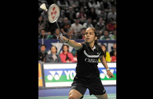 In this photo released by China's Xinhua news agency, India's Saina Nehwal return a shot against China's Wang Shixian on her way to winning the women's singles final at the Hong Kong Open Badminton Super Series in Hong Kong Sunday, Dec. 12, 2010. (AP Photo/Xinhua, Lo Ping Fai)