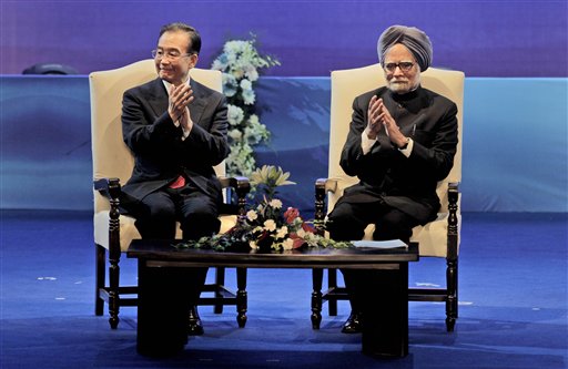 Indian Prime Minister Manmohan Singh, right, and Chinese Premier Wen Jiabao clap at the closing ceremony of the Festival of China in India and the 60th anniversary of the established diplomatic relations between the two countries, in New Delhi, India, Thursday, Dec. 16, 2010. The leaders of India and China called Thursday for a stronger partnership, a huge increase in trade and even the creation of an emergency hotline as they stressed a spirit of cooperation, not competition between Asia's two rising powers.