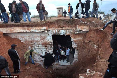 Rescuers find seven emaciated prisoners 'buried alive in underground cell in Gaddafi's compound'