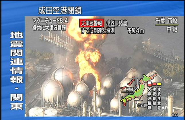 In this image taken from NHK television, a flame rises from petrochemical complex in Ichikawa, near Tokyo Friday, March 11, 2011. Japan was struck by a magnitude 8.9 earthquake off its northeastern coast Friday, unleashing a 13 foot (4 meter) tsunami that washed away cars and tore away buildings along the coast near the epicenter. (AP Photo/NHK) JAPAN OUT, TV OUT, NO SALES, ONLINE OUT, EDITORIAL USE ONLY