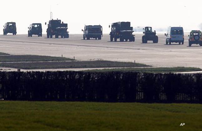 Ordnance is moved along the runway at RAF Marham, south east England Saturday March 19, 2011. British Prime Minister David Cameron ordered RAF Typhoon and Tornado fighter jets to deploy to the Mediterranean to help impose a no fly zone in Libya authorized by United Nations Security Council resolution 1973, which said all necessary measures short of military occupation should be taken to protect civilians from forces loyal Moammar Gadhafi. (AP Photo/Chris Radburn/PA Wire)