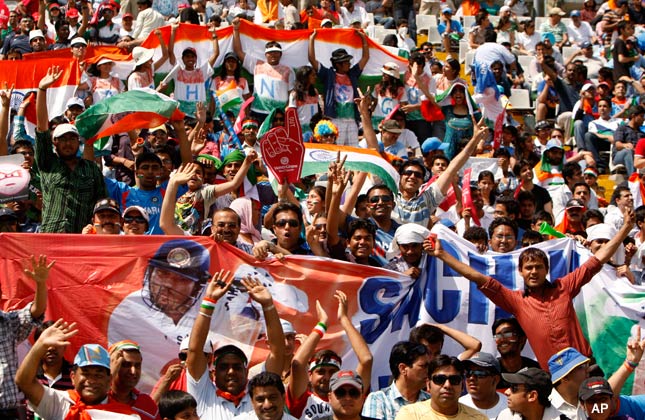 Cricket supporters cheer before the start of the Cricket World Cup semifinal match between Pakistan and India in Mohali, India, Wednesday, March 30, 2011. (AP Photo/Gurinder Osan)