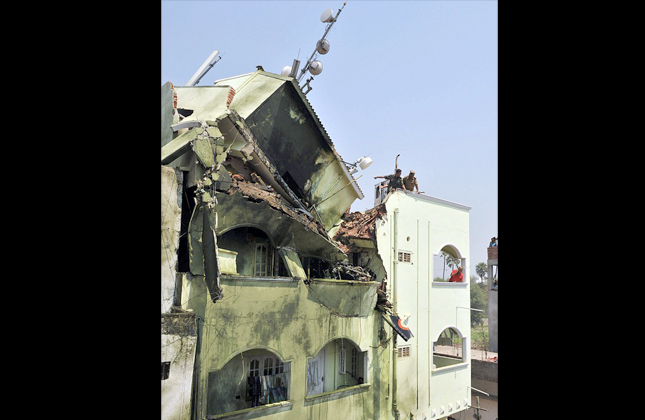 Demolished Both pilots in the Kiran Mark II jet aircraft were killed after it crashed into this house in Hyderabad