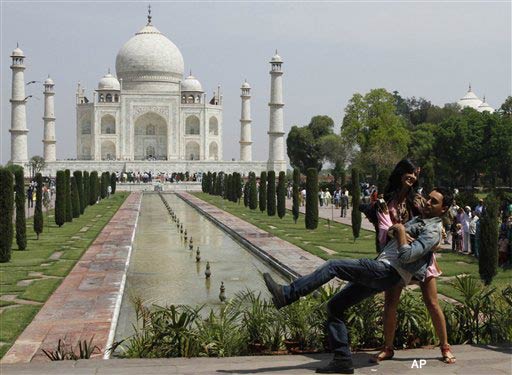 Bollywood actors Imran Khan, front and Katrina Kaif shoot for a Bollywood movie at the Taj Mahal in Agra, India, Wednesday, April 13, 2011. (AP Photo/Rajesh Kumar Singh)