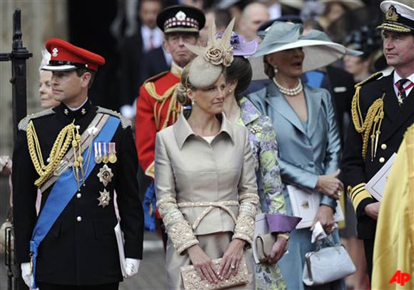 Britain's Prince Edward, Sophie Rhys Jones, Countess of Wessex, Britain's Princess Anne (hidden) and British Vice Admiral Timothy James Hamilton Laurence, husband of Britain's Princess Anne, from left, leave Westminster Abbey after the wedding service at the Royal Wedding in London Friday, April, 29, 2011. (AP Photo/Martin Meissner)