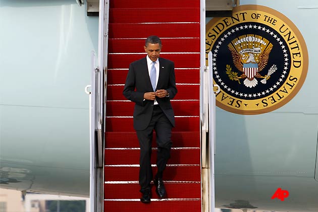 President Barack Obama walks down the stairs from Air Force One upon arrival at Andrews Air Force Base, Md. on Friday, May 6, 2011.(AP Photo/Jose Luis Magana)