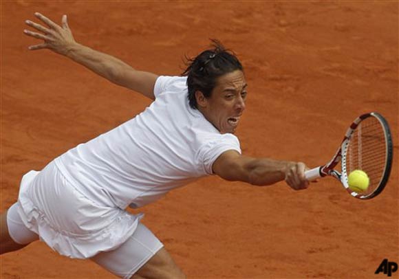 Francesca Schiavone of Italy returns against Anastasia Pavlyuchenkova of Russia in the quarter final match of the French Open tennis tournament in Roland Garros stadium in Paris, Tuesday May 31, 2011. Schiavone won in three sets 6 1, 7 5, 7 5. (AP Photo/Michel Spingler)