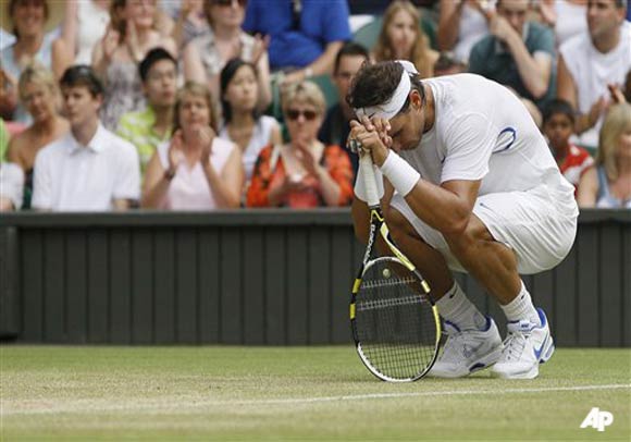 Spain's Rafael Nadal reacts during the match against Argentina's Juan Martin Del Potro at the All England Lawn Tennis Championships at Wimbledon, Monday, June 27, 2011. (AP Photo/Kirsty Wigglesworth)