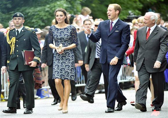 Prince William, second right, the Duke of Cambridge laughs with his wife Kate, the Duchess of Cambridge during a ceremony at Rideau Hall in Ottawa on Thursday, June 30, 2011. (AP Photo/The Canadian Press, Nathan Denette)