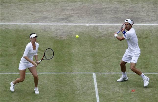 Austria's Jurgen Meltzer, right, and Iveta Benesova of the Czech Republic in action against India's Mahesh Bhupathi and Elena Vesnina in the mixed doubles at the All England Lawn Tennis Championships at Wimbledon, Sunday, July 3, 2011. (AP Photo/Alastair Grant)