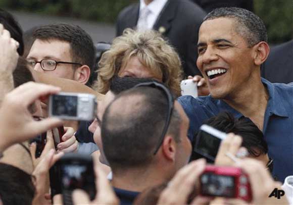 President Barack Obama welcomes military families to an Independence Day celebration on the South Lawn of the White House in Washington, Monday, July 4, 2011. (AP Photo/Charles Dharapak)