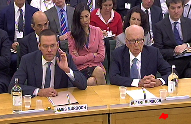 James Murdoch, left, and Rupert Murdoch, give evidence to the Culture, Media and Sport Select Committee on the News of the World phone hacking scandal in this image taken from TV in Portcullis House in central London Tuesday July 19 2011. (AP Photo/ PA UNITED KINGDOM OUT