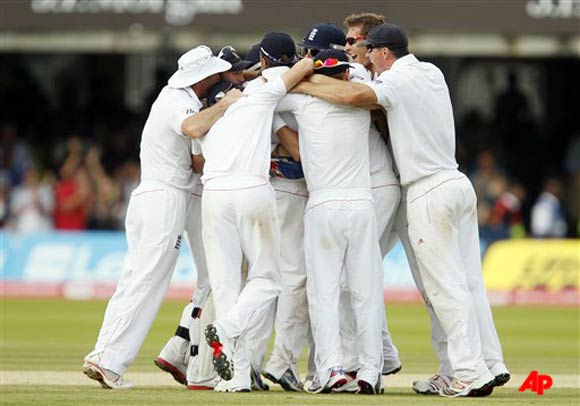 The England cricket team celebrate after defeating India in the first Test at Lord's Cricket ground in London, Monday, July, 25, 2011. (AP Photo/Alastair Grant)