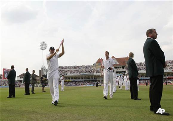 England's Tim Bresnan, centre left, and Stuart Broad, centre right, hold stumps as they walk from the pitch with teammates after their team's win over India on the fourth day of their cricket test match at Trent Bridge cricket ground, Nottingham, England, Monday Aug. 1, 2011. (AP Photo/Jon Super)