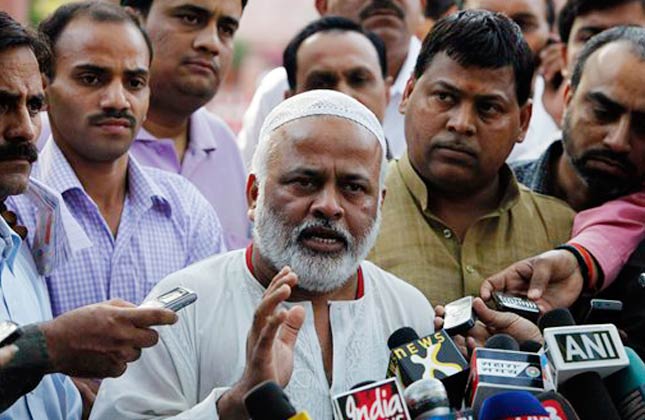 Janata Dal United party leader Aijaz Ali, center, and Samajwadi Party leader Subhash Yadav, right, address the media after being suspended because of their behavior in the Rajya Sabha, the upper house of parliament Monday, in New Delhi, India, Tuesday, March 9, 2010. Socialist lawmakers forced India's parliament to adjourn twice Tuesday as they tried for a second day to block passage of a historic bill to increase the number of female lawmakers across the country. On Monday, angry legislators in the Rajya Sabha rushed to the chairman's seat as he presided over the session, tore up copies of the bill and tried to grab his microphone. (AP Photo/Mustafa Quraishi)