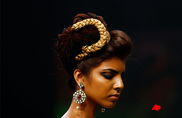 An Indian model displays creations by designer Neeta Lulla during the Lakme Fashion Week in Mumbai, India, Saturday, Aug. 20,2011. (AP Photo/Rafiq Maqbool)