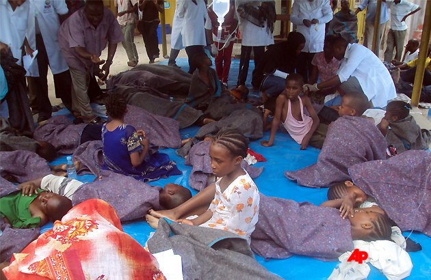 Child survivors are cared for after being saved from the waters Saturday, Sept 10, 2011, after an overcrowded ship sank in deep sea between mainland Tanzania and Pemba Island at about 1 a.m. Saturday with about 600 people onboard. The numbers involved are unclear as the ferry, M.V. Spice Islanders, is thought to have been heavily overloaded and some potential passengers refused to board when it was leaving the mainland port of Dar es Salaam, said survivor Abdullah Saied. About 230 people have been rescued and 40 bodies recovered but about 370 people are still reported missing, said Mohamed Aboud, minister for the Vice President's Office. (AP Photo/ Ali Sultan )