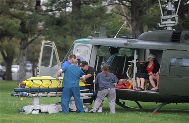 Medics help injured bystanders out of a helicopter into Renown Medical Center after a plane crashed into the crowd at the Reno National Championship Air Races Friday, Sept. 16, 2011 in Reno, Nev. A World War II era fighter plane plunged into the grandstands Friday during a popular annual air show, injuring at least 75 spectators and leaving a horrific scene of bodies and wreckage. (AP Photo/The Reno Gazette Journal, Liz Margerum)