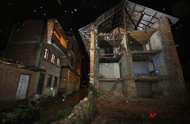 A view of a damaged house after an earthquake in Bhaktapur, on the outskirts of in Katmandu, Nepal, Sunday, Sept. 18, 2011. A strong earthquake shook northeastern India and Nepal on Sunday night, killing at least 16 people, damaging buildings and sending lawmakers in Nepal's capital running into the streets.(AP Photo/Niranjan Shrestha)
