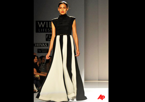 A model displays a creation by designers Gauri and Nainika at the Wills Lifestyle India Fashion Week Spring Summer 2012, in New Delhi, India, Saturday, Oct. 8, 2011. (AP Photo/Tsering Topgyal)