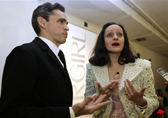 Fashion designer Isabel Toledo, right, stands with her husband Ruben, left, as they are interviewed before her spring and summer collection show, Wednesday, Oct. 19, 2011, in Miami. (AP Photo/Lynne Sladky)