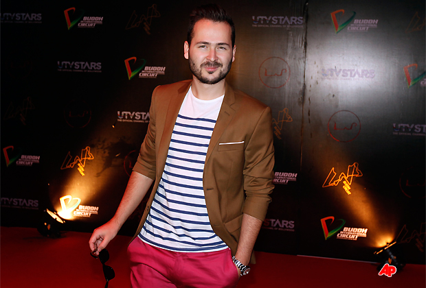 Romanian musician Edward Maya poses for the media at the Lap Buddh International Circuit after a party in Noida, 38 kilometers (24 miles) from New Delhi, India Saturday, Oct. 29, 2011. (AP Photo/ Mustafa Quraishi)