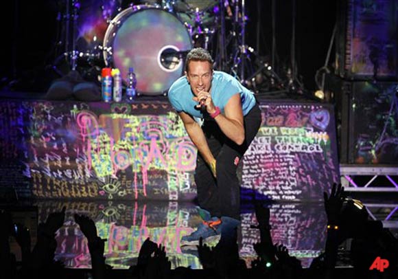 Chris Martin of the band Coldplay performs at the MTV European Music Awards 2011, in Belfast, Northern Ireland Sunday, Nov. 6, 2011. (AP Photo/Joel Ryan)