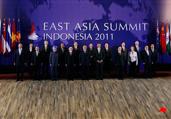 U.S. President Barack Obama poses for a group photo at the East Asia Summit in Nusa Dua, on the island of Bali, Indonesia, Saturday, Nov. 19, 2011. Pictured from left to right Russian Foreign Minister Sergei Lavrov Thai Prime Minister Yingluck Shinawatra Japanese Prime Minister Yoshihiko Noda Singaporean President Lee Hsien Loong Indian Prime Minister Manmohan Singh Cambodian Prime Minister Hun Sen South Korean President Lee Myung bak Philippines President Benigno Aquino III Indonesian President Susilo Bambang Yudhoyono Brunei Sultan Hassanal Bolkiah President Obama Myanmar President Thein Sein Chinese Premier Wen Jiabao Vietnamese Prime Minister Nguyen Tan Dung Australian Prime Minister Julia Gillard Malaysian Prime Minister Najib Razak New Zealand Foreign Minister Murray McCully Laos' President Choummaly Saignason. (AP Photo/Charles Dharapak)