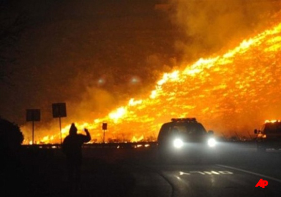 A massive inferno burning across the mountains of northwest Nevada has evacuated thousands from the area to residents horror as firefighters fight for the many homes and potential lives swept up in the blaze.