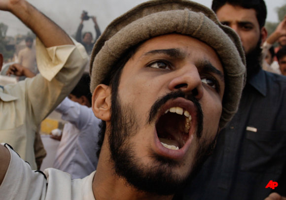 A Pakistani protester shouts anti American slogans in Lahore, Pakistan on Saturday, Nov. 26, 2011. Pakistan on Saturday accused NATO helicopters and fighter jets of firing on two army checkpoints in the country's northwest and killing 24 soldiers. Islamabad retaliated by closing the border crossings used by the international coalition to supply its troops in neighboring Afghanistan. (AP Photo/K.M.Chaudary)