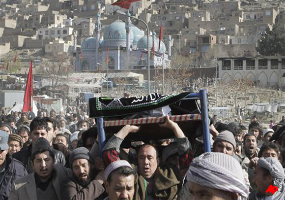 Afghans carrying a body for funeral, who was killed in Tuesday's suicide attack in Kabul, Afghanistan, Wednesday, Dec. 7, 2011. A suicide bomber slaughtered 56 Shiite worshippers and wounded more than 160 others Tuesday outside a shrine where hundreds had gathered to commemorate the holiday of Ashoura, which honors the death of Imam Hussein, a grandson of the Prophet Muhammad, in 680 A.D. (AP Photo/Musadeq Sadeq)