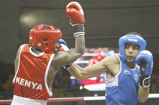 Indian boxer Amandeep, right, trades punches against Peter Mungai of Kenya in the Light Fly 49 kg final of Commonwealth Boxing Championships in New Delhi, India, Wednesday, March 17, 2010. Amandeep won the gold. (AP Photo/Saurabh Das)