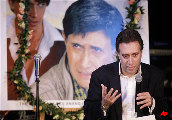 Tony Sarin, nephew of Dev Anand, addresses the well wishers during a memorial service for Bollywood actor and director Dev Anand at the Bharatiya Vidya Bhavan centre in London, Saturday, Dec. 10, 2011. Famed Bollywood actor Anand died of cardiac arrest in London Dec. 3 2011, and his remains are to be returned to India for immersion burial in the Godavari river. (AP Photo/Sang Tan)