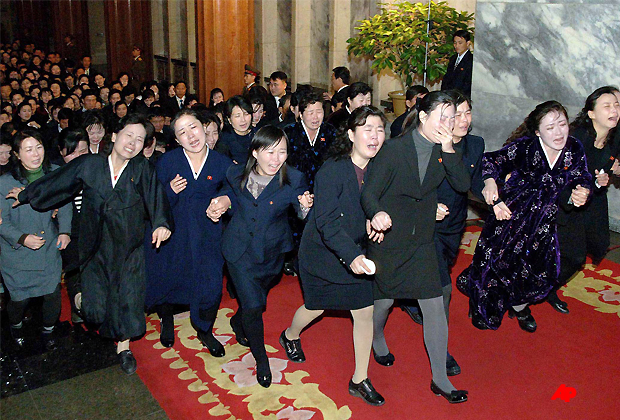 In this Tuesday, Dec. 27, 2011 photo released by the Korean Central News Agency and distributed in Tokyo Wednesday, Dec. 28, 2011 by the Korea News Service, North Koreans visit the Kumsusan Memorial Palace to pay respects to late North Korean leader Kim Jong Il in Pyongyang, North Korea. (AP Photo/Korean Central News Agency via Korea News Service)