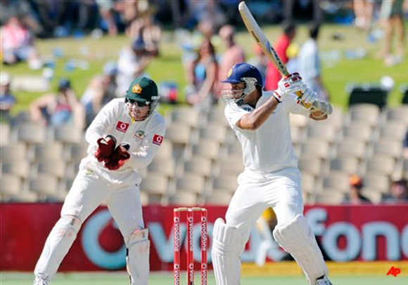 India's V.V.S. Laxman, right, bats against Australia during their cricket test match in Adelaide, Australia, Friday, Jan. 27, 2012. (AP Photo/David Mariuz)