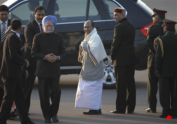 Indian Defence Minister A.K Anthony, fifth left, looks at Indian Prime Minister Manmohan Singh, fourth left, during Beating Retreat ceremony in New Delhi, India, Sunday, Jan. 29, 2012. The ceremony marks the end of Republic Day festivities. (AP Photo/Saurabh Das)