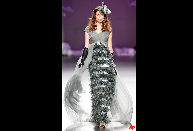 A model displays an Autum/Winter design by Francis Montesinos during the Madrid's Mercedes Benz Fashion Week, in Madrid, Wednesday, Feb. 1, 2012. (AP Photo/Daniel Ochoa de Olza)