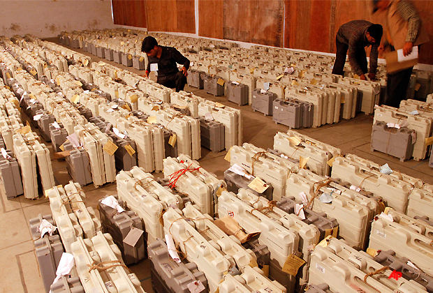 Indian workers count electronic voting machines meant for use in the Uttar Pradesh state elections, in Lucknow, India, Tuesday, March 6, 2012. Election officials across five Indian states Tuesday began counting votes in crucial provincial elections that are being seen as a test of strength for the country's ruling Congress party. (AP Photo/Rajesh Kumar Singh)