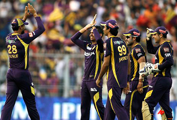 Sunil Narine, second left without cap, of Kolkata Knight Riders is congratulated by teammates after claiming five wickets during their Indian Premier League (IPL) cricket match against Kings XI Punjab in Kolkata, India, Sunday, April 15, 2012. (AP Photo/Bikas Das)