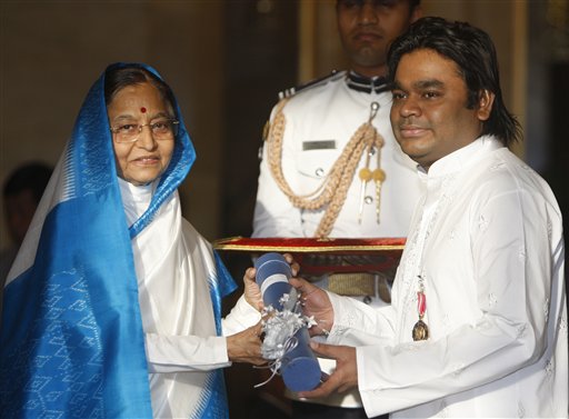 Indian President Pratibha Patil, left, presents the Padma Bhushan, one of India's highest civilian awards to Bollywood music composer A R Rahman at the Presidential Palace in New Delhi, India, Wednesday, March 31, 2010. (AP Photo/Mustafa Quraishi)