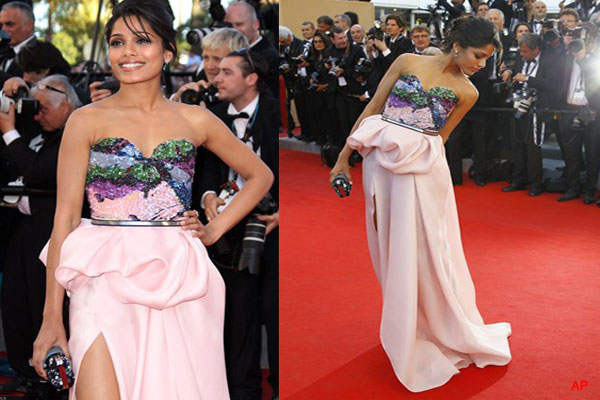 Actress Freida Pinto arrives for the opening ceremony and screening of Moonrise Kingdom at the 65th international film festival, in Cannes, southern France, Wednesday, May 16, 2012. (AP Photo/Francois Mori)