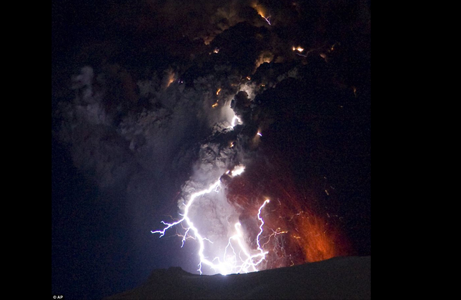 Lightning, caused by collisions of volcanic dust, is seen amid the lava and ash erupting from the vent of the Eyjafjallajokull volcano