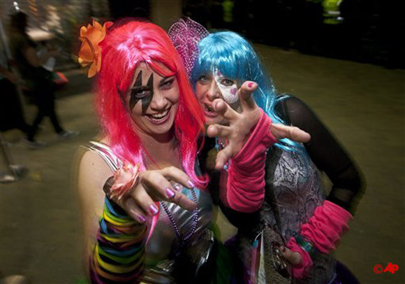 Lady Gaga fans Makeeta Hole, left, and Sarah Hodges pose outside the pop star's concert in Brisbane, Australia, on Wednesday, June 13, 2012. (AP Photo/Patrick Hamilton)